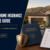 California homebuyer reviewing homeowners insurance and mortgage approval documents before closing in 2026